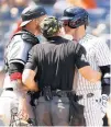  ?? SARAH STIER/TNS ?? Umpire Nick Mahrley attempts to separate White Sox catcher Yasmani Grandal, left, and the Yankees’ Josh Donaldson on Saturday at Yankee Stadium in New York.