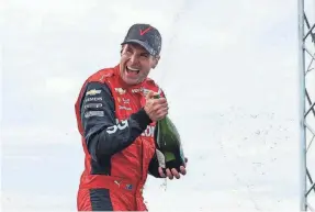  ?? NTT INDYCAR SERIES ?? Will Power celebrates in the James Scott Memorial Fountain after winning IndyCar’s Detroit Grand Prix on Belle Isle.