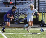  ?? CONTRIBUTE­D ?? Centervill­e senior Caleb McComas (right) possesses the ball against St. Xavier during Saturday’s Division I regional final.