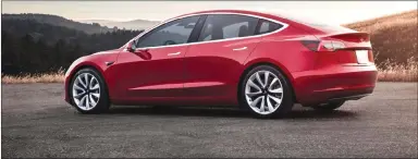  ?? Associated Press photo ?? This undated photo provided by Tesla shows the Tesla Model 3, which delivers a sporty ride with a premium feel.