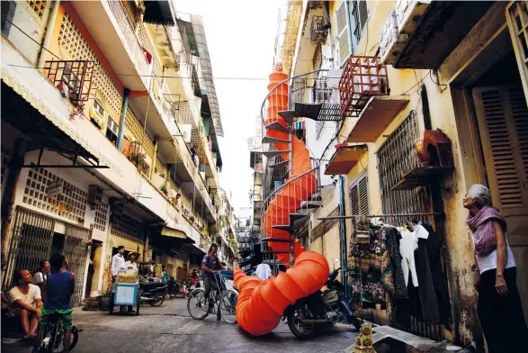  ??  ?? snaking saffron Spiral Alley, a work from Anida Ali’s performanc­e series The Buddhist Bug Project, won the Sovereign Asian Art Prize
this year