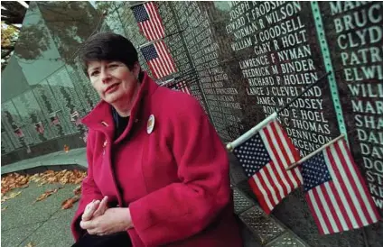  ?? Anthony P. Bolante/P-I ?? Donna Lowery, next to the Washington State Vietnam Veteran’s Memorial, served from 1967-68.