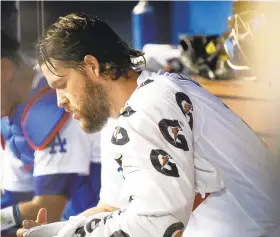  ?? GINA FERAZZI/LOS ANGELES TIMES ?? Dodgers ace Clayton Kershaw ranks third on the defending World Series champs’ payroll but he starts this postseason on the injured list.