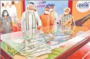  ?? MUKESH UPADHYAYA/HT PHOTO ?? PM Narendra Modi, CM Yogi Adityanath and governor Anandiben Patel taking a look at the exhibition models of Raja Mahendra Pratap Singh State University, in Aligarh.