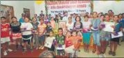  ?? HT PHOTO ?? Young boys and girls pose after the tie draw at the opening ceremony of the Shashank Shekhar Singh Memorial AITA Championsh­ip Series in Lucknow on Sunday.