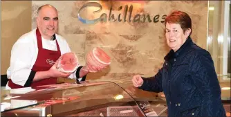  ??  ?? Noreen Mangan, Killorglin ordering her ham for Christmas from Mike Cahillane at Cahillane’s Butchers, Killorglin. Photo by Michelle Cooper Galvin.