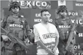  ?? Alexandre Meneghini
Associated Press ?? ALLEGED DRUG CARTEL member Daniel Ramirez is brought before the media in Mexico City.