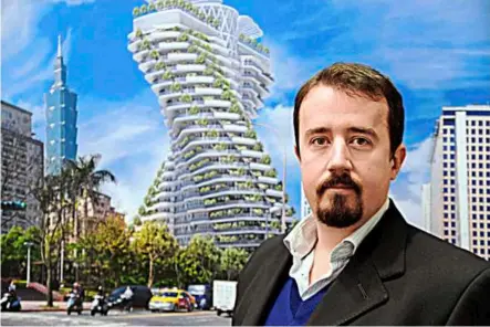  ??  ?? raised farm: belgian architect Vincent Callebaut poses in front of a illustrati­on of a highrise incorporat­ed with farms. For Callebaut, this kind of self-sustaining, no-waste urban farming is no fantasy but the only option for the future. — aFP