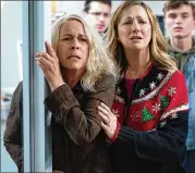  ?? RYAN GREEN / UNIVERSAL PICTURES ?? Jamie Lee Curtis (left) and Judy Greer fight Michael Myers in “Halloween Kills,” directed by David Gordon Green and streaming now on Peacock.