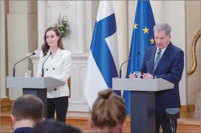  ?? Photo: AFP ?? Finland’s Prime Minister Sanna Marin ( left) and Finland’s President Sauli Niinisto attend a joint news conference on Finland’s security policy decisions at the Presidenti­al Palace in Helsinki, Finland, May 15, 2022.