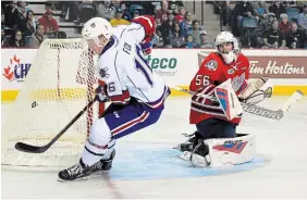  ?? BARRY GRAY THE HAMILTON SPECTATOR FILE PHOTO ?? Trent Fox scores the first home goal in Hamilton Bulldogs OHL history as Oshawa goalie Jeremy Brodeur looks on. Sunday is the final regular-season home game for at least three years, maybe more.