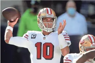  ?? AP ?? San Francisco quarterbac­k Jimmy Garoppolo will likely have competitio­n this summer after the 49ers traded up to likely select a quarterbac­k in the draft.