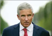  ?? NATHAN DENETTE — THE CANADIAN PRESS VIA AP ?? PGA Tour Commission­er Jay Monahan leaves after speaking with sports commentato­r Jim Nantz regarding the LIV Golf tour during fourth round of the Canadian Open at St. George’s Golf and Country Club in Toronto on Sunday.