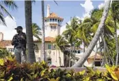  ?? EVAN VUCCI AP FILE ?? A security guard stands on the perimeter of former President Donald Trump’s Mar-a-Lago residence.