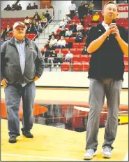  ?? (NWA Democrat-Gazette/Mark Humphrey) ?? Farmington athletic director Brad Blew (right) retired Jan. 31 after serving the School District 34 years as a teacher, coach and athletic director. Superinten­dent of schools Bryan Law introduced Blew and the School Board presented him a plaque honoring his years of service at Cardinal Arena.