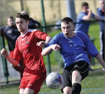  ??  ?? Justin Curran, Cartron United in action with Adam Lynch of Merville United. Pic: Carl Brennan.