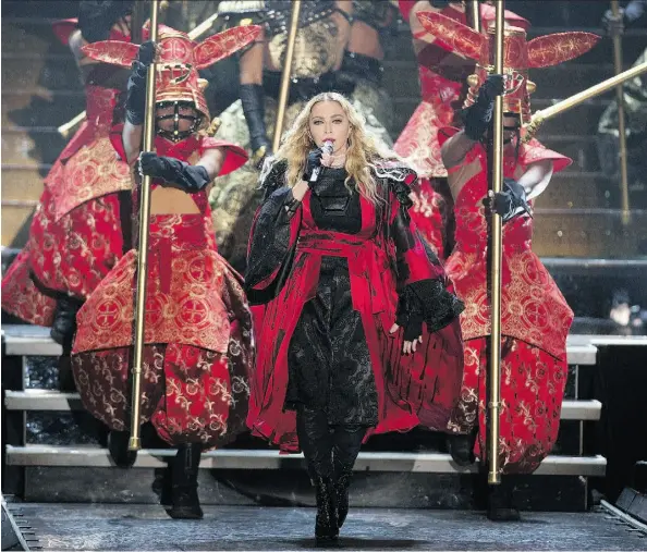  ?? GREG SOUTHAM/EDMONTON JOURNAL ?? Madonna entertains the sold-out crowd at Rexall Place on Sunday.