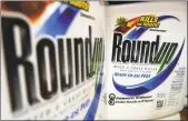  ?? Jeff Roberson / Associated Press ?? Environmen­talists have expressed concern about the state’s use of Roundup, a weed killer made by Monsanto.