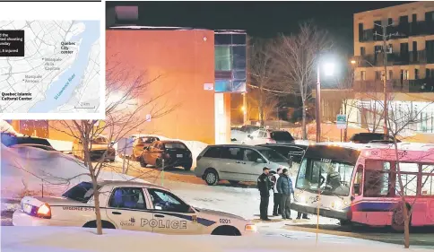  ??  ?? Police officers speak near the mosque after the shooting in Quebec City. — Reuters photo