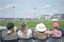  ?? ?? COUNTY ATTRACTION: Supporters enjoy the sunshine during the County Championsh­ip match between Gloucester­shire and Yorkshire.