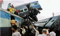  ?? - PTI ?? MANGLED: Coaches of the Puri-Haridwar Utkal Express train after it derailed in Khatauli near Muzaffarna­gar on Saturday.
