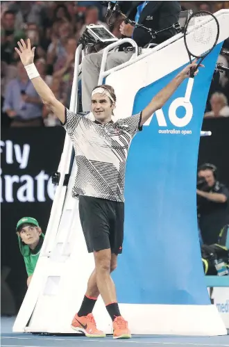  ?? SCOTT BARBOUR/AFP/GETTY IMAGES ?? Roger Federer celebrates his win against Rafael Nadal in the men’s singles final of the Australian Open on Sunday in Melbourne, Australia. The victory gave him his 18th grand slam title.