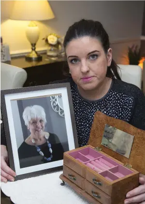  ?? Photo: Colin O’Riordan ?? Sinead Quinn, from Blanchards­town, Dublin, with a photograph of her late mother Patti and, right, some of the pieces of jewellery that were taken in the burglary at her home.