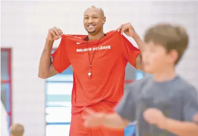  ?? MARLA BROSE/JOURNAL ?? Ex-University of New Mexico standout J.R. Giddens, who’s helping out at the Lobo Basketball Camp, is thriving as a pro player these days, but has eyes on a bigger prize when his career ends.