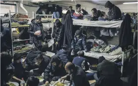  ??  ?? Migrants live in an overcrowde­d room in Miral camp, Velika Kladusa, Bosnia