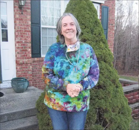  ?? John Torsiello / For Hearst Connecticu­t Media ?? Margaret Gumbs, aka “Maggie Mcfly Designs,” wears one of her colorful tie-dyed creations.