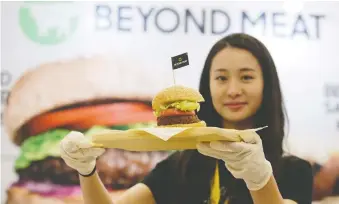  ?? JASON LEE/REUTERS FILES ?? Cargill plans to offer soy protein or pea protein-based patties and ground products in April. It is competing with the likes of Beyond Meat, which offers plant-based burgers like the one above.