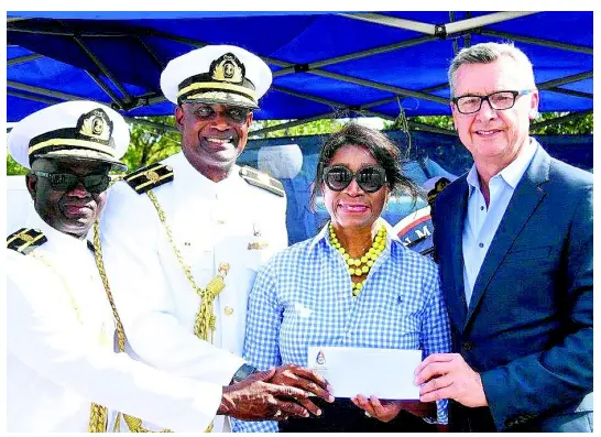  ??  ?? From left: Professor Ibrahim Ajagunna, vice-president of academic and student affairs, Caribbean Maritime University (CMU), and Professor Fritz Pinnock, president, CMU, receive the cheque of US$50,000 from Dr Geneive Brown Metzger, president of the ACMF, and Michael Bayley, president and CEO of RCI.