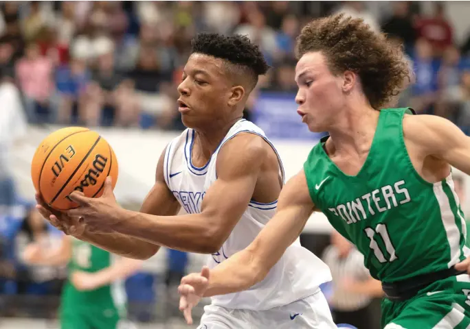  ?? File photo/NWA Democrat-Gazette ?? Van Buren’s Jaiden Henry, shown defending a Bryant player, returns for his senior season, but the opposition will change a great deal as the Pointers make the move to the 5A-West Conference this season. Van Buren will trade games against Northwest Arkansas teams for schools such as Greenwood, Alma and Siloam Springs.