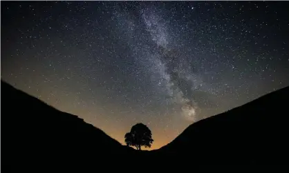  ?? Photograph: Owen Humphreys/PA ?? The objects have been seen close to the supermassi­ve black hole at the centre of the Milky Way, which is seen here from Sycamore Gap in Northumber­land.