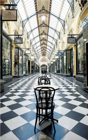  ?? — AFP ?? Eerily quiet: A deserted shopping arcade in downtown Melbourne amid a sixth lockdown in efforts to bring the Delta outbreak to heel.