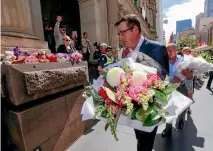  ?? GETTY IMAGES ?? Victorian Premier Daniel Andrews lays flowers at Bourke Street Mall yesterday to honour the victims of the attack.