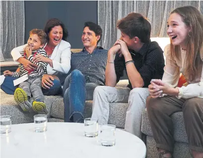  ?? SEAN KILPATRICK THE CANADIAN PRESS ?? Liberal Leader Justin Trudeau watches election results on Monday evening with wife Sophie Grégoire Trudeau and children (from left) Xavier, Hadrien and Ella-Grace at Liberal headquarte­rs in Montreal.