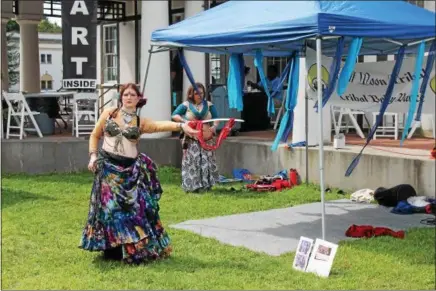 ?? PHOTOS BY LAUREN HALLIGAN — LHALLIGAN@DIGITALFIR­STMEDIA.COM ?? A bellydance­r performs at the Saratoga Arts Celebratio­n, a juried fine art and craft festival held over the weekend at the National Museum of Dance in Saratoga Springs.