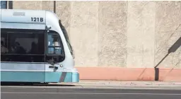  ?? NICK OZA/THE REPUBLIC ?? Residents use light rail in downtown Phoenix.
