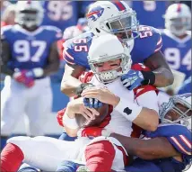  ?? AP PHOTOS ?? Carson Palmer was sacked five times and was intercepte­d four times Sunday against the Bills