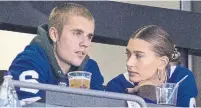  ?? CHRIS YOUNG THE CANADIAN PRESS FILE PHOTO ?? Justin Bieber and wife Hailey Baldwin check out a Toronto Maple Leafs game in November.