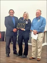  ?? Contribute­d ?? AdventHeal­th Gordon EMS Director Mike Ethridge (left) and Deputy Director Donald Bowen (right) present the EMT of the Year Award to EMT Paige Hall (center).