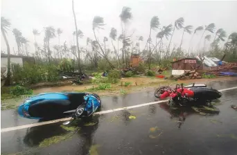  ?? AP ?? Motorcycle­s lie on a street in Puri district after cyclone Fani hit the coastal state of Odisha.