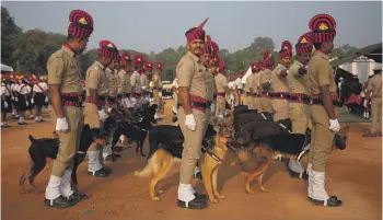  ?? GETTY IMAGES ?? The K-9 unit of the Karnataka State Police participat­es in a full dress rehearsal parade to celebrate India’s Republic Day in January in Bengaluru, home to India’s “silicon valley”.