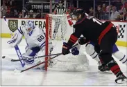  ?? KARL B DEBLAKER — THE ASSOCIATED PRESS ?? The Hurricanes’ Jordan Staal controls the puck near Maple Leafs goaltender Joseph Woll during the second period on Sunday in Raleigh, N.C.