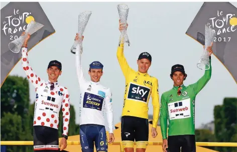  ??  ?? Die Protagonis­ten der diesjährig­en Tour de France: Der beste Bergfahrer Warren Barguil, der beste Jungprofi Simon Yates, der alte und neue Tour-Sieger Christophe­r Froome und der beste Sprinter Michael Matthews (von links).
FOTO: CAMUS/DPA