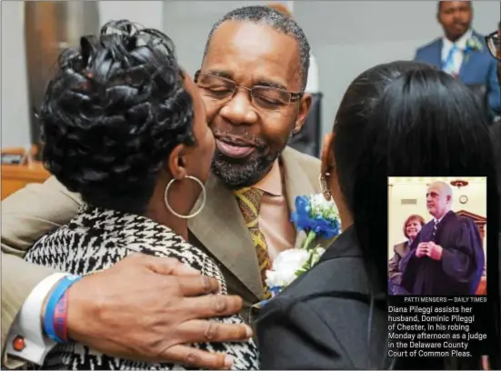  ?? RICK KAUFFMAN — DAILY TIMES ?? Chester Mayor Thaddeus Kirkland, center, embraces daughter Shareeta Joe, left, and wife Susie Kirkland, right, after taking the oath of office on Monday in Chester City Hall.