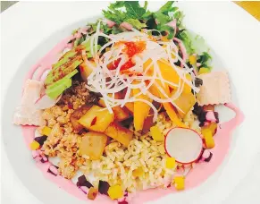  ??  ?? The West Coast Bowl contains quinoa, sashimi-style albacore tuna, roasted beets, brown rice, avocado, pickled carrots, and beet chips.