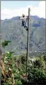  ?? Special to the Democrat-Gazette/
ROB ROEDEL ?? John Hawkins of First Electric Cooperativ­e works on a power pole in Guatemala in October.