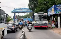  ??  ?? The small junction in front of an RTC bus shelter causes traffic snarls almost all the day at the beginning of RK Puram bridge. — DC